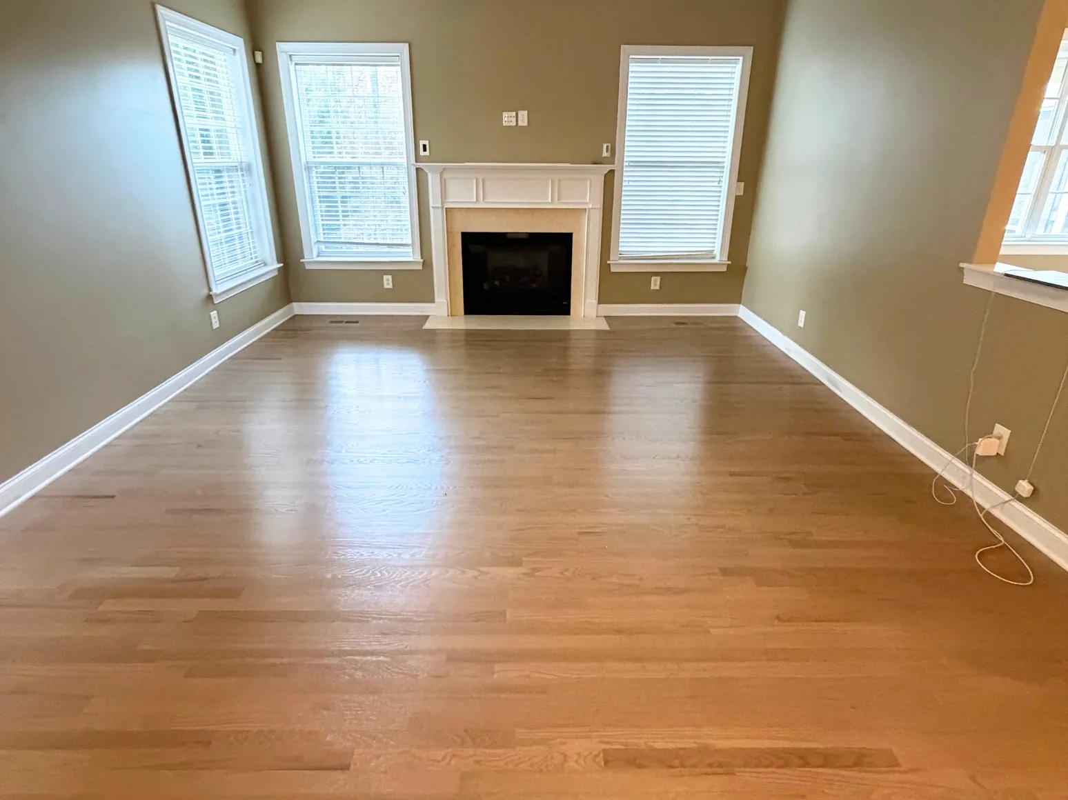 After hardwood installation: Living room, carpet to natural oak
