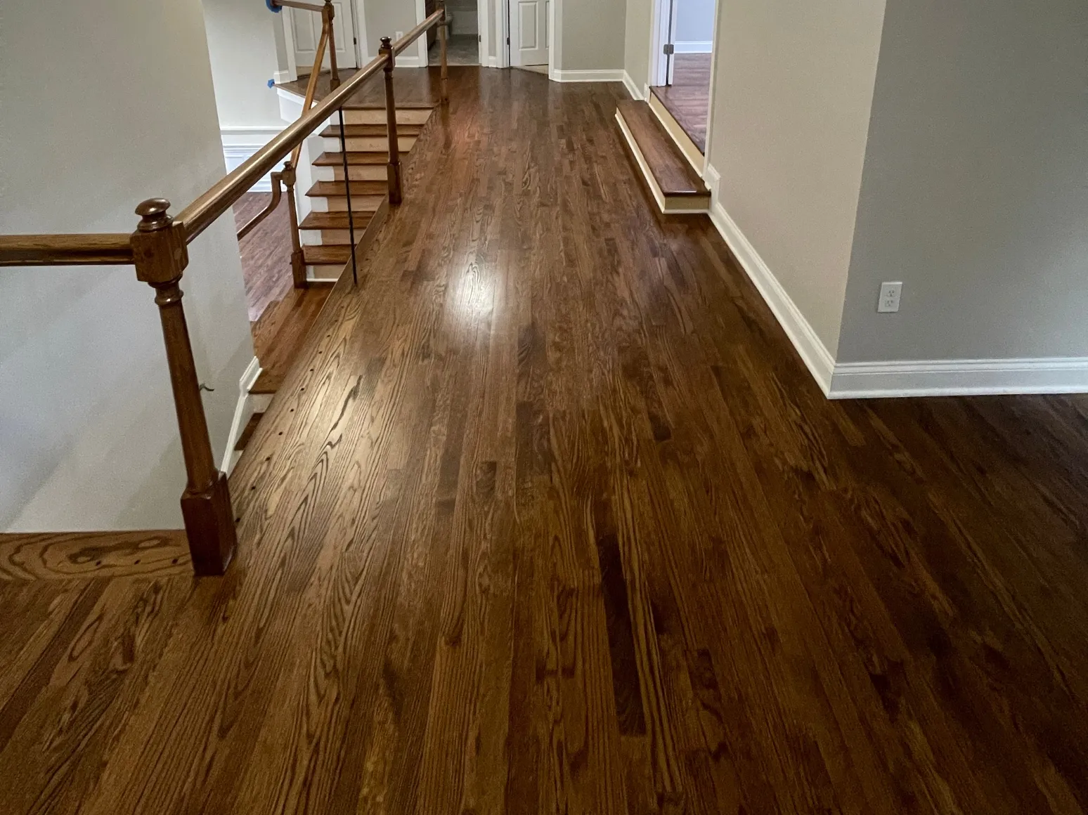 After hardwood installation: Upstairs hallway, carpet to hardwood
