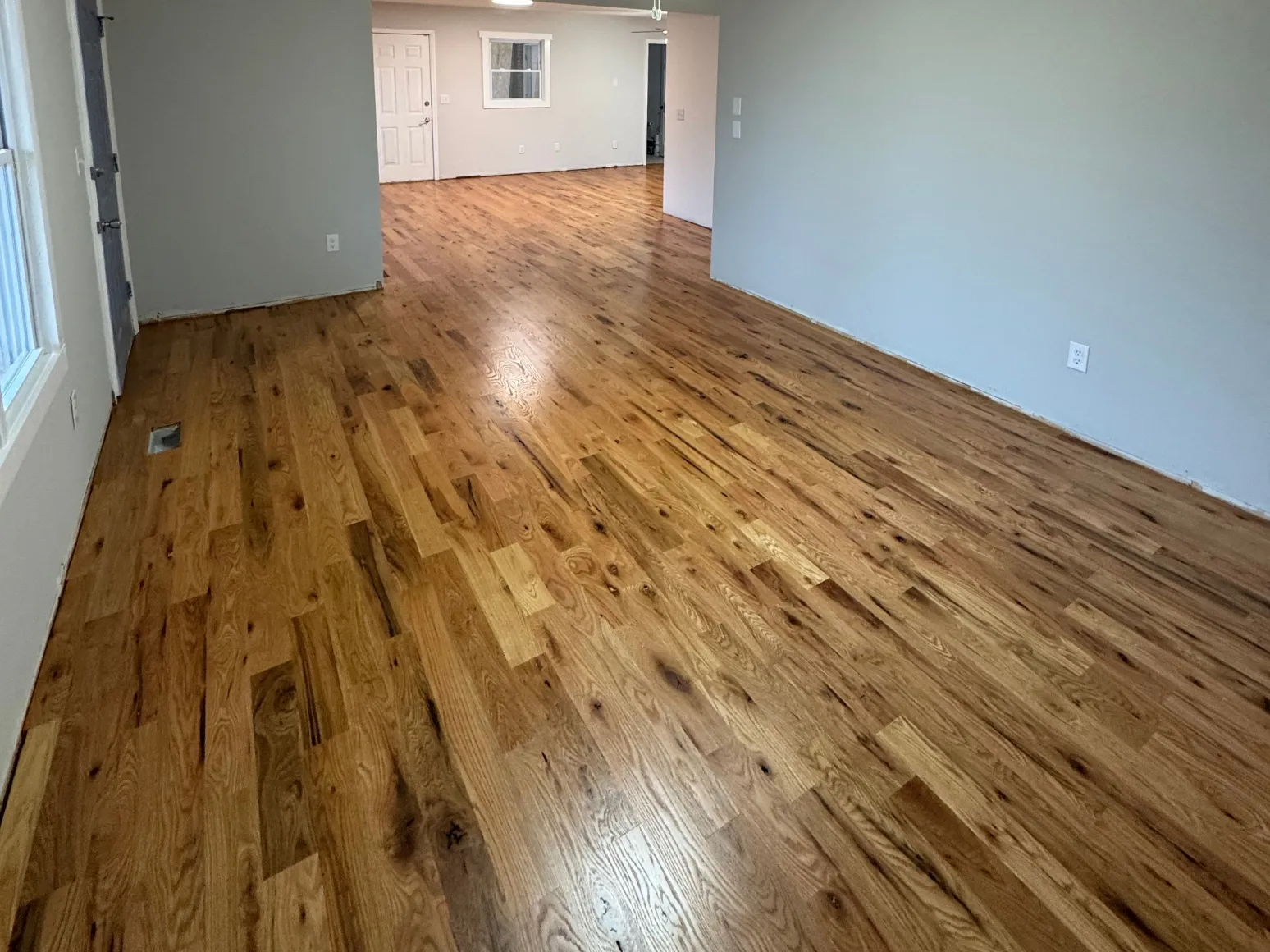 After hardwood installation: Great room, plywood subfloor to oak