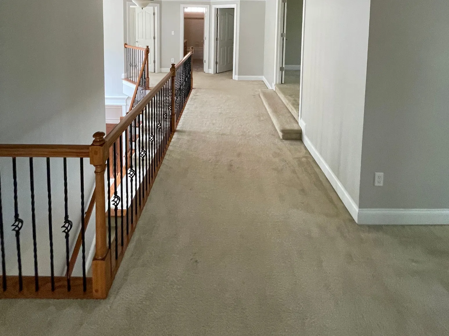 Before hardwood installation: Upstairs hallway, carpet to hardwood