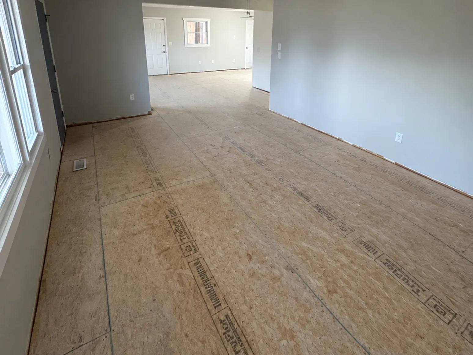 Before hardwood installation: Great room, plywood subfloor to oak