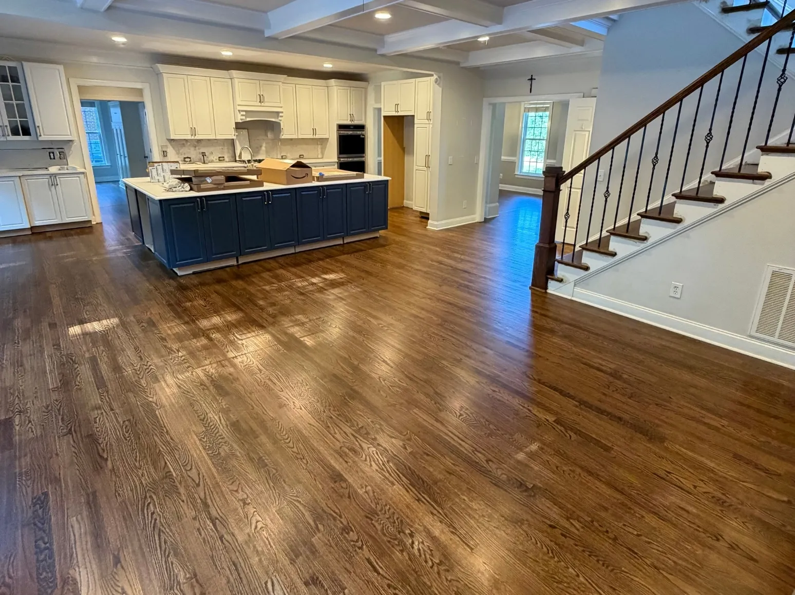 After refinishing: Kitchen and staircase, deeper brown stain