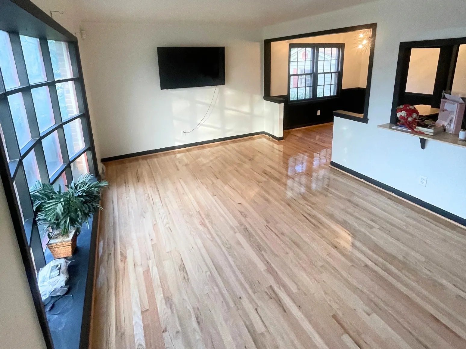 After refinishing: Sunny living room, sanded to bare oak