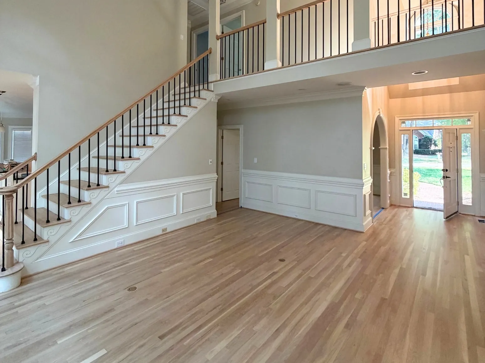 After refinishing: Entry foyer, orange oak to natural