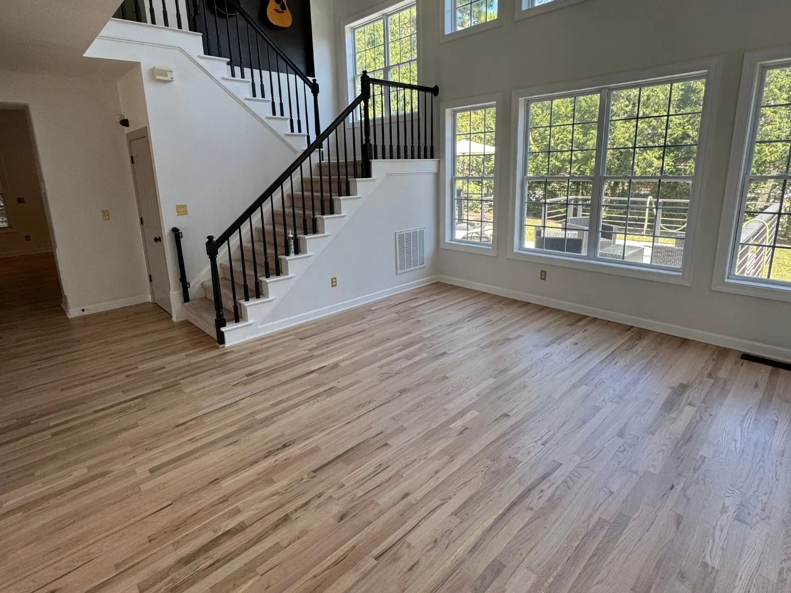 After refinishing: Staircase great room, orange oak to natural