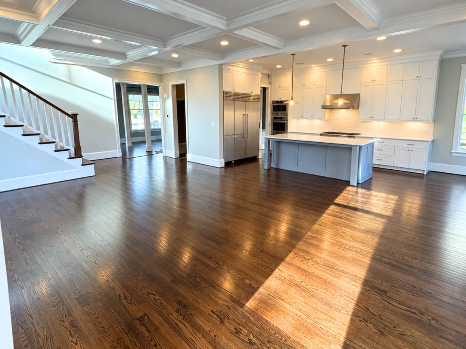 Before refinishing: Open-plan oak, dark stain to natural finish