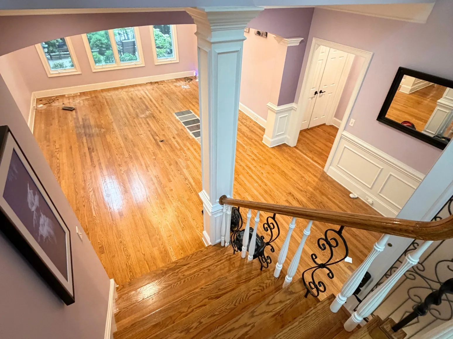 Before refinishing: Foyer and staircase, orange oak to charcoal
