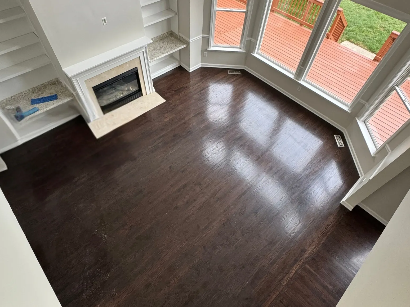 Before refinishing: Bay window living room, dark gray-brown