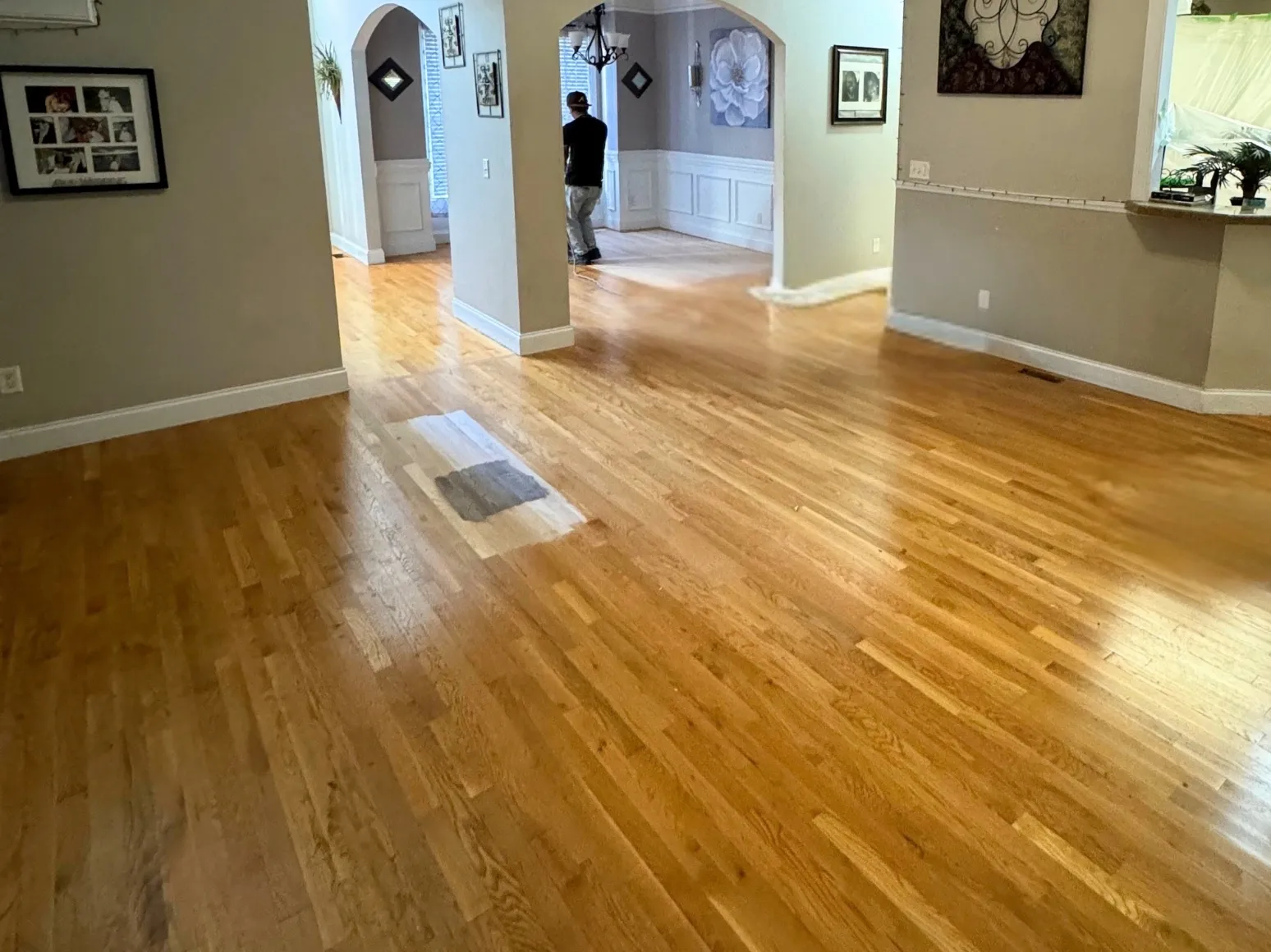 Before refinishing: Open hallway, honey oak to rich brown