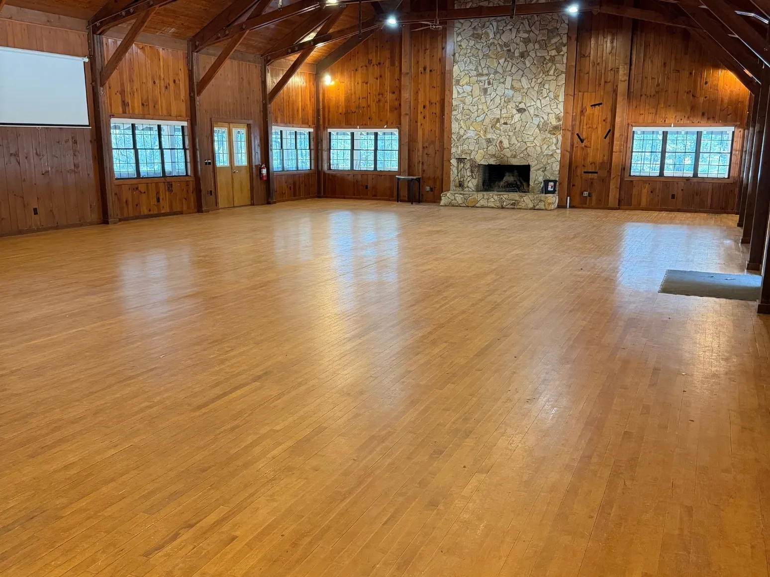 Before refinishing: Lodge great room, fresh glossy finish