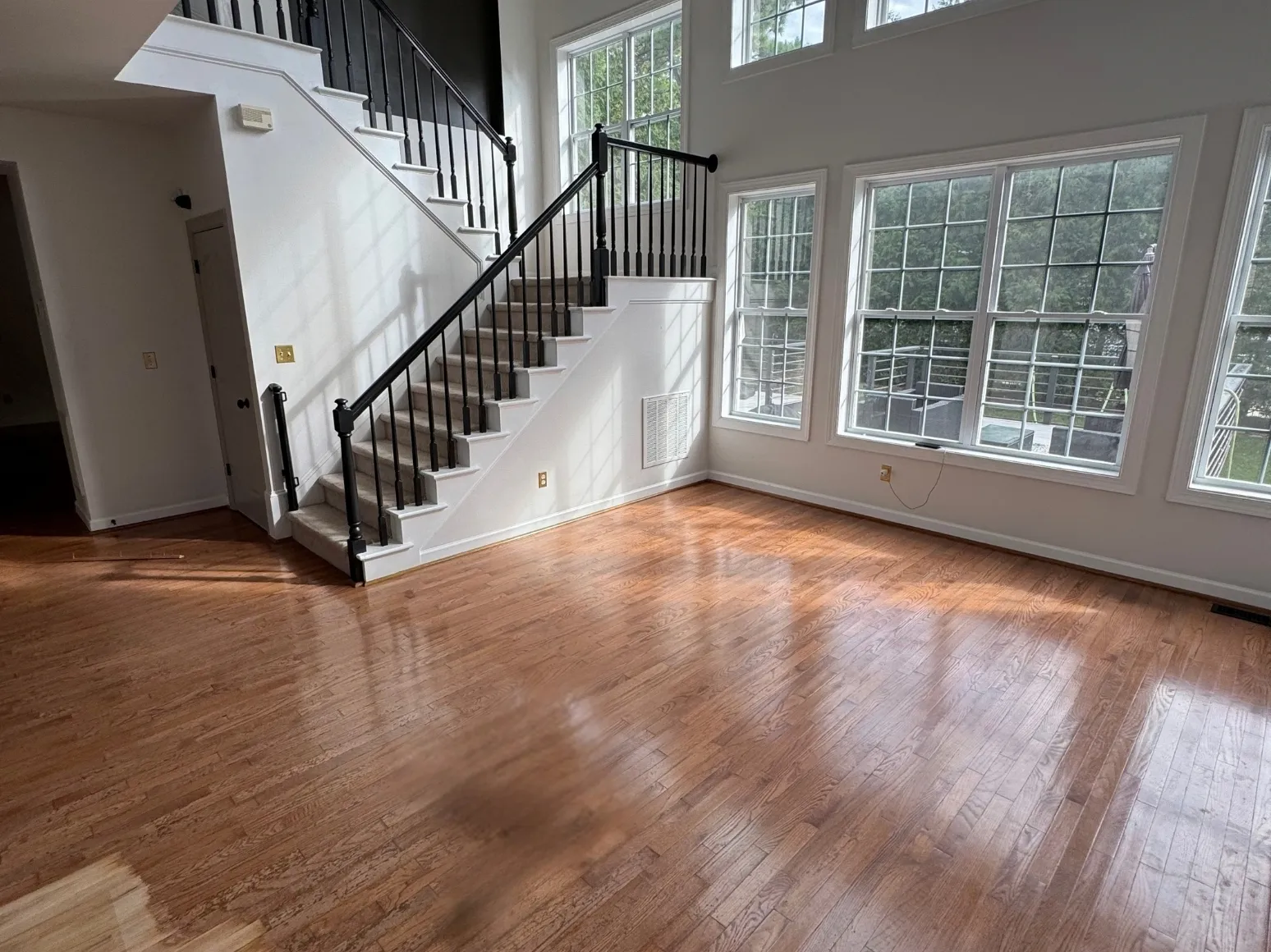Before refinishing: Staircase great room, orange oak to natural