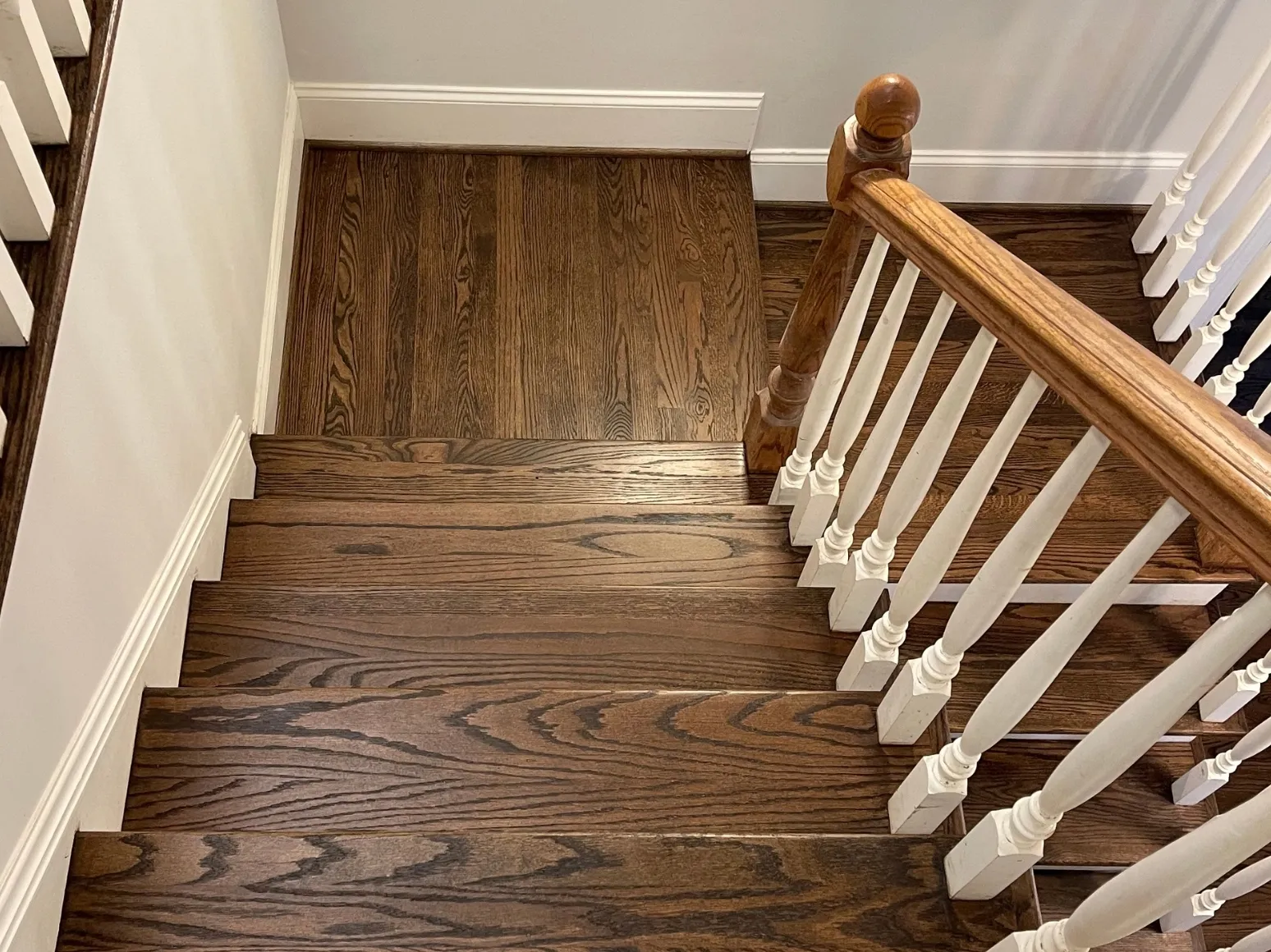 After staircase refinishing: Landing and staircase, honey oak to rich brown