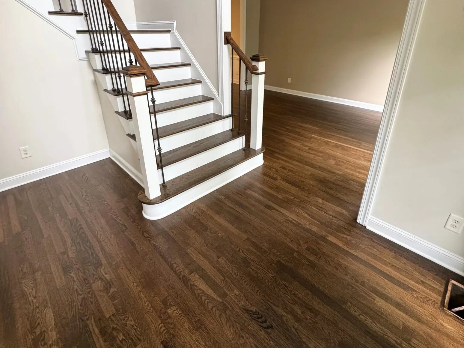 After staircase refinishing: Entry stairs and floor, orange to dark espresso