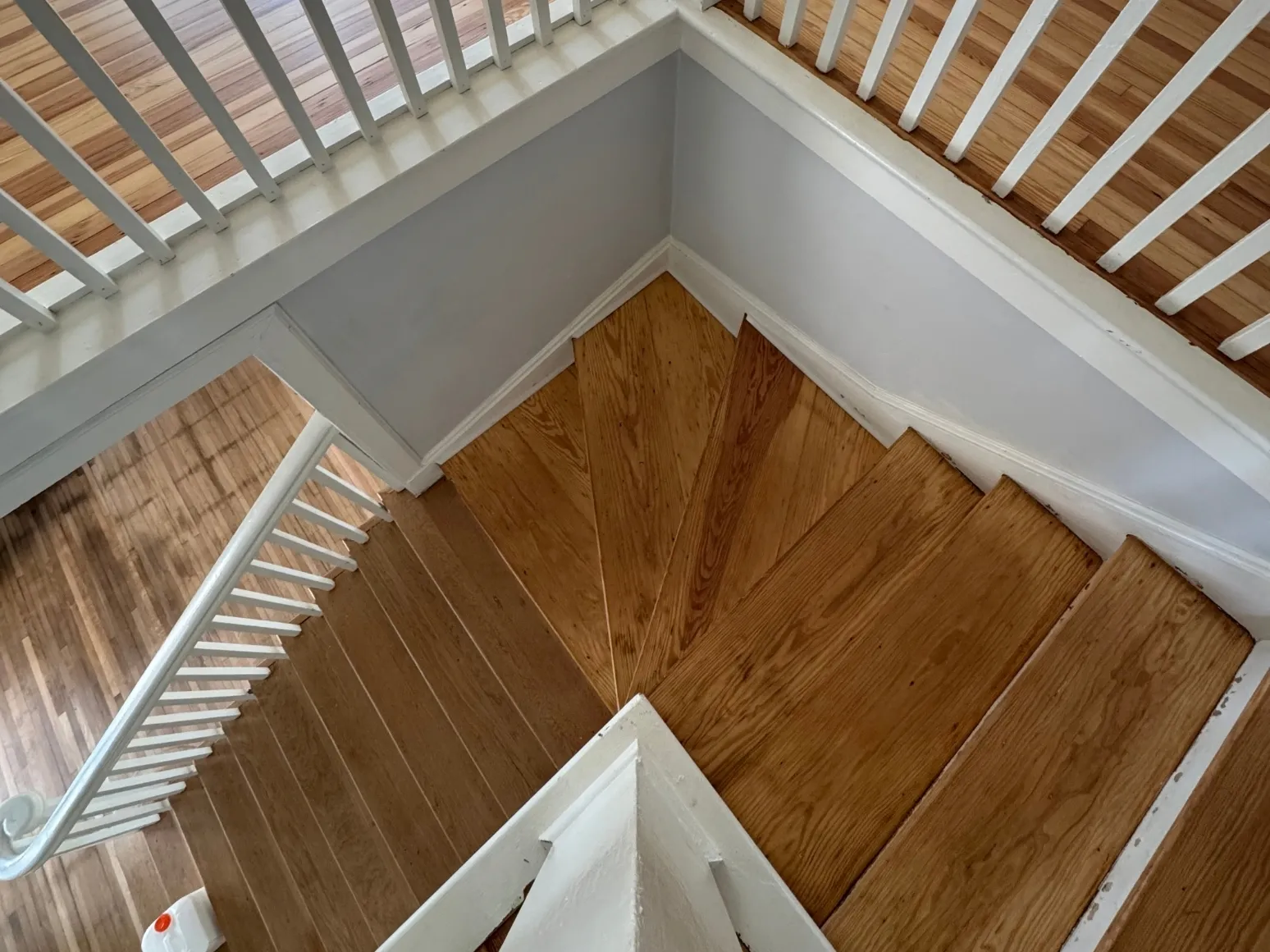 After staircase refinishing: Black painted stairs back to natural oak
