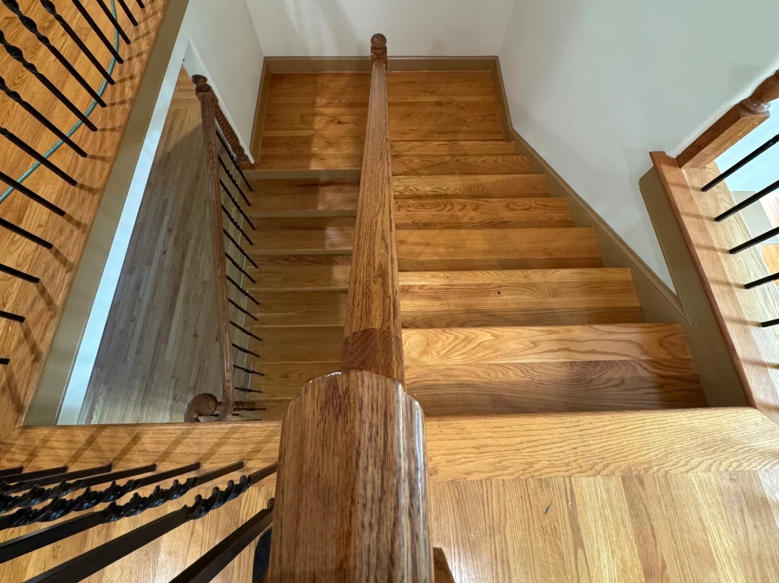 Before staircase refinishing: Staircase landing, honey oak refresh