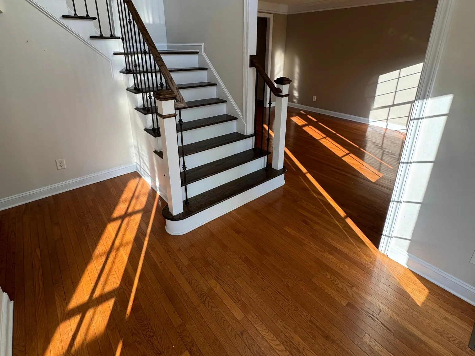 Before staircase refinishing: Entry stairs and floor, orange to dark espresso
