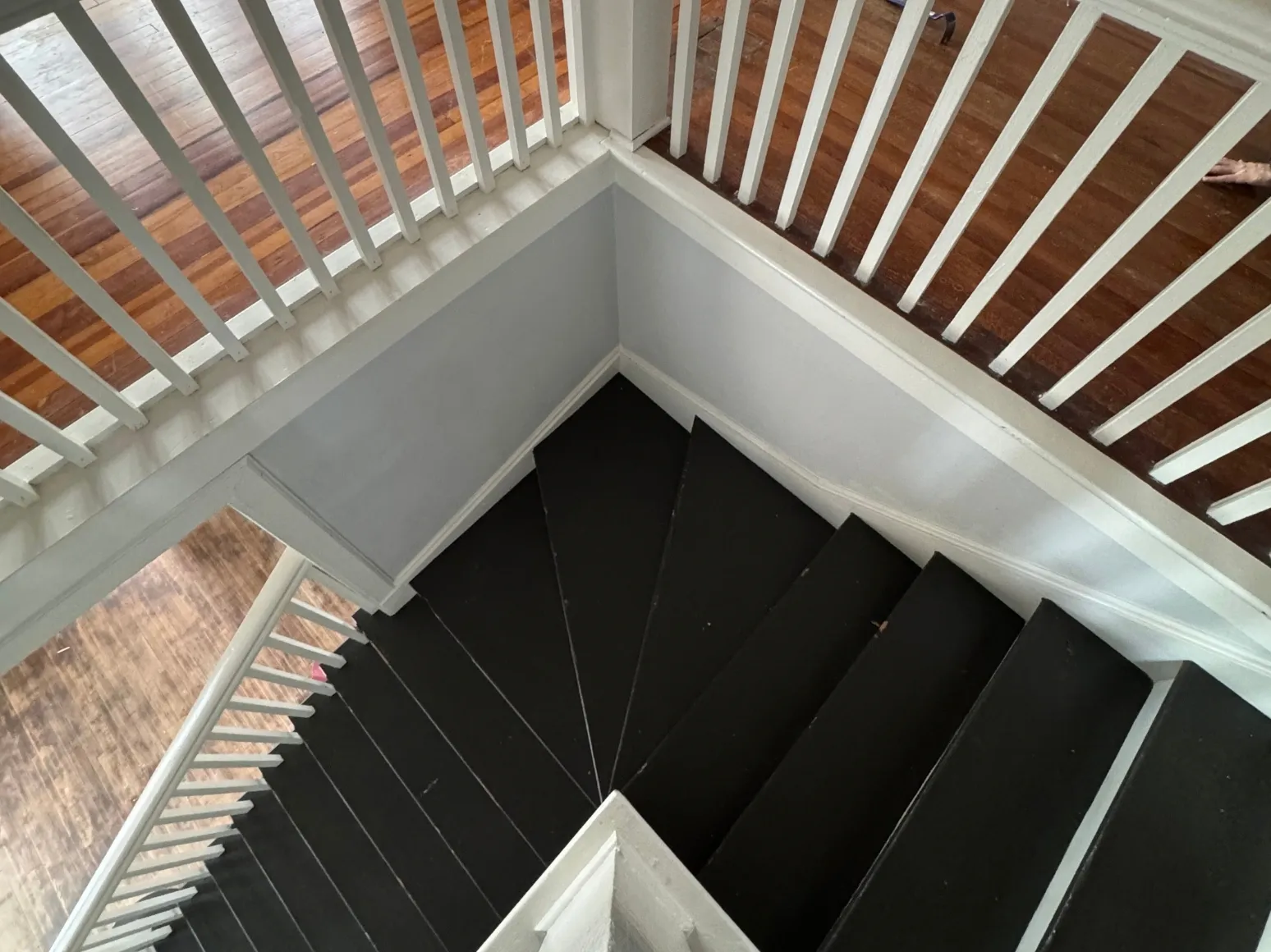 Before staircase refinishing: Black painted stairs back to natural oak
