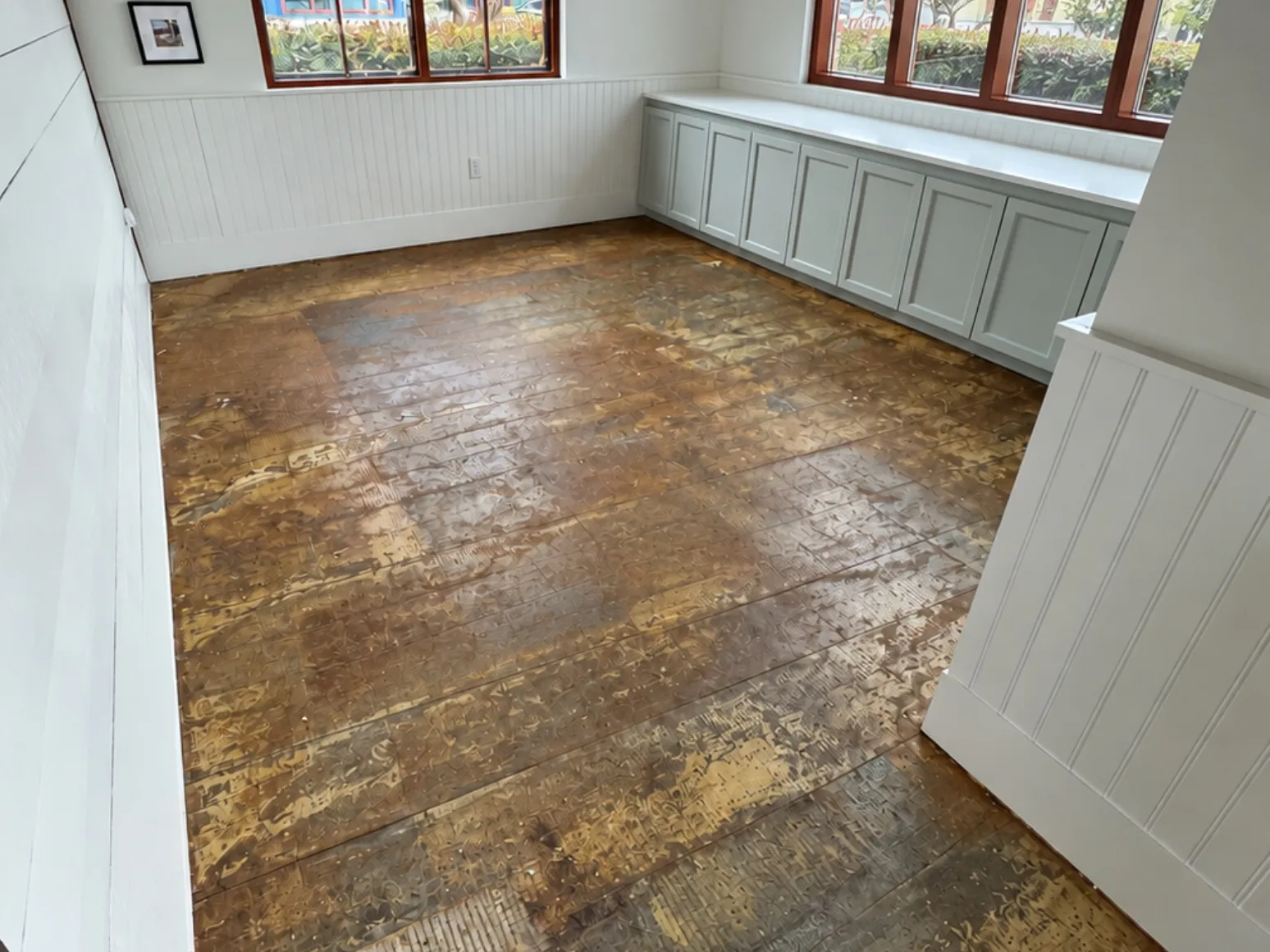 Before luxury vinyl plank installation: Sunroom, old adhesive subfloor to LVP