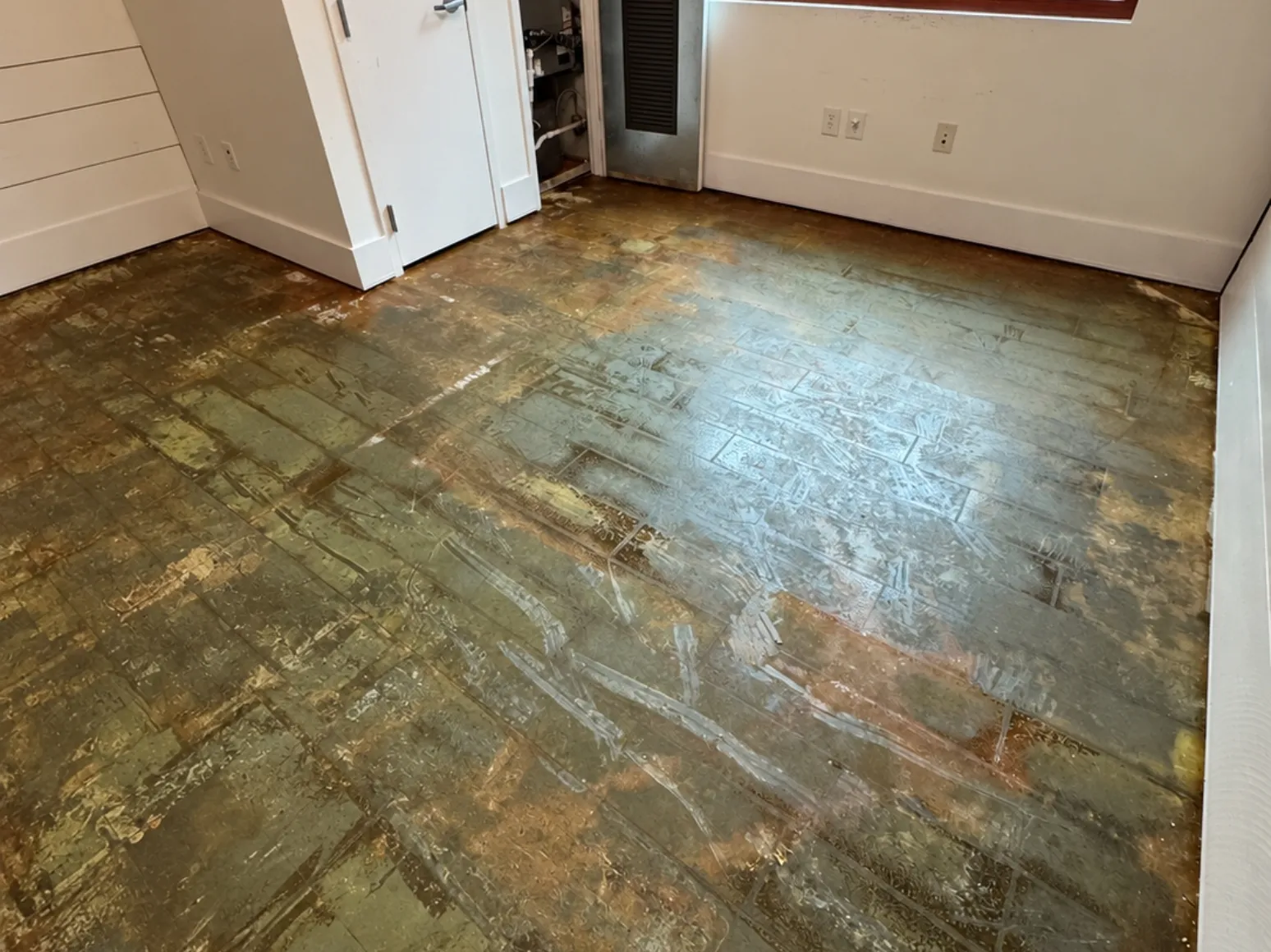 Before luxury vinyl plank installation: Mudroom, bare subfloor to light LVP