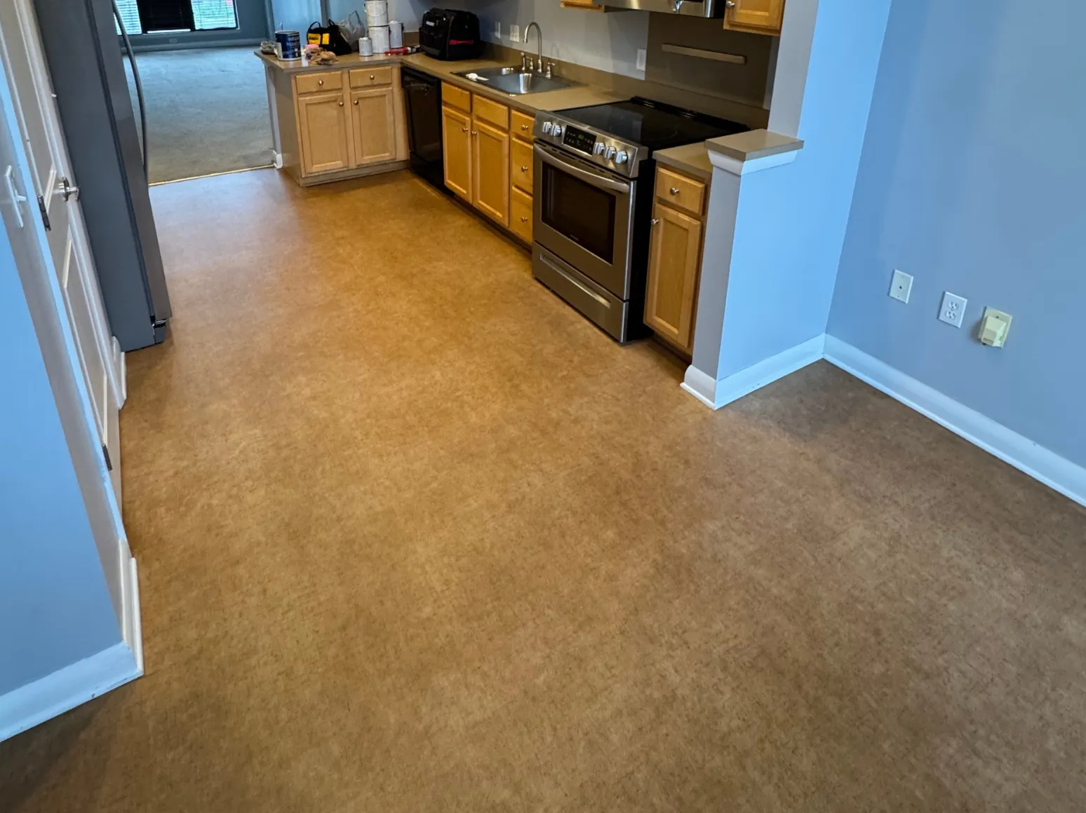 Before luxury vinyl plank installation: Kitchen, sheet vinyl to long-plank LVP