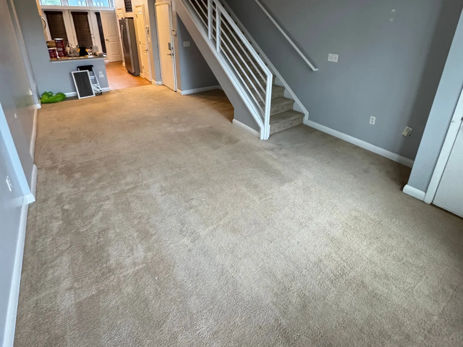 Before luxury vinyl plank installation: Living room, carpet to gray-brown LVP